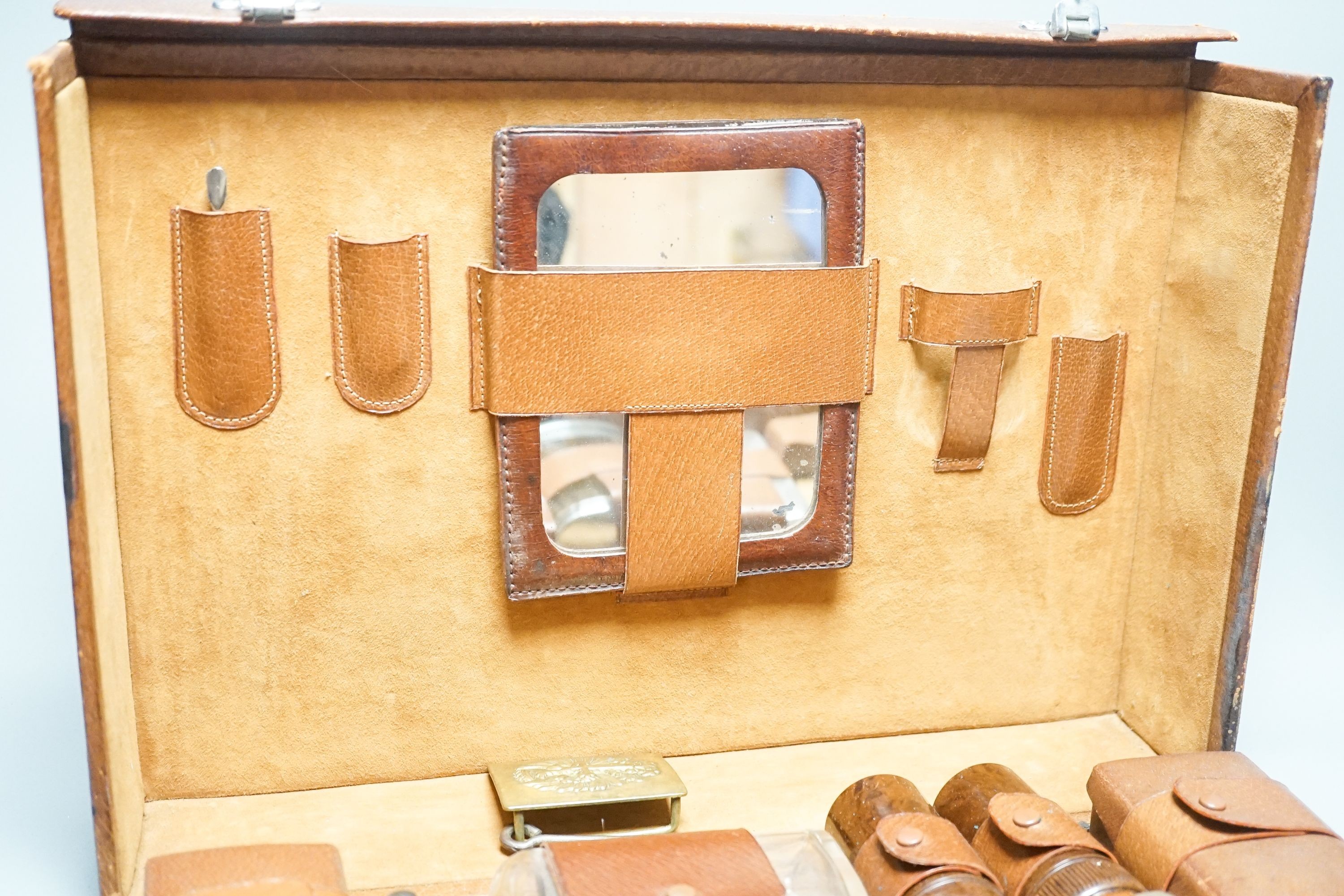 Leather travelling toilet set, some silver lids, and belt.